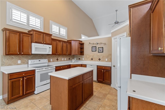 kitchen with white appliances, light tile patterned floors, backsplash, ceiling fan, and high vaulted ceiling