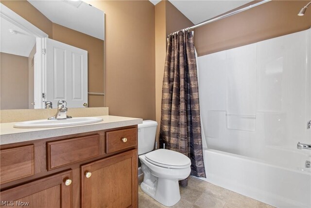 full bathroom with vanity, toilet, shower / bath combo, and tile patterned flooring