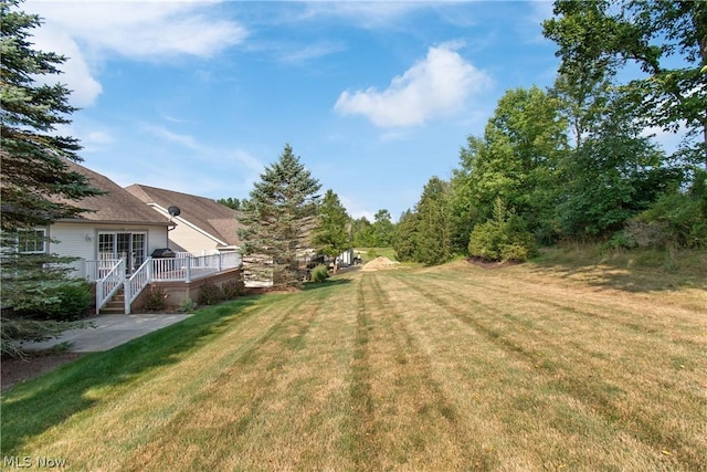 view of yard with a deck