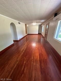 spare room with dark hardwood / wood-style flooring