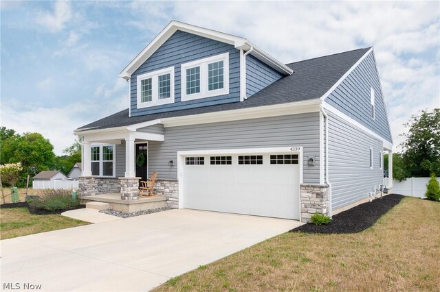 craftsman-style home featuring a front yard