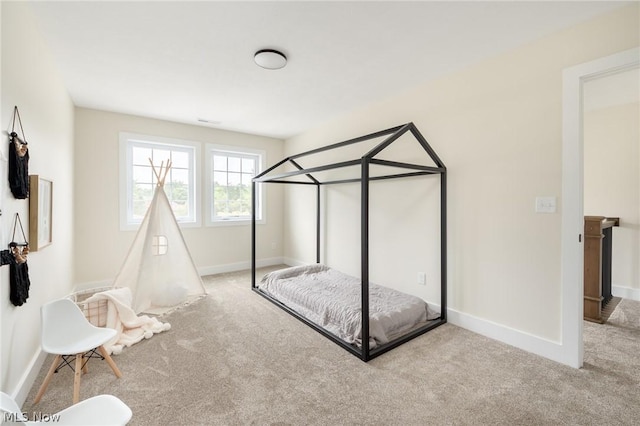 unfurnished bedroom featuring light carpet