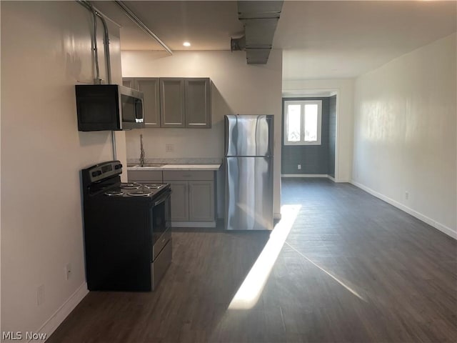 kitchen with sink, gray cabinets, and stainless steel appliances