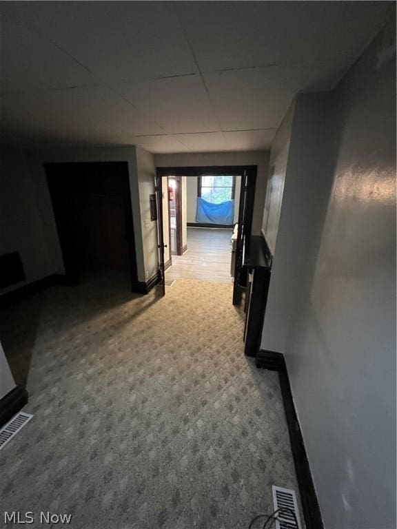 hallway with carpet flooring