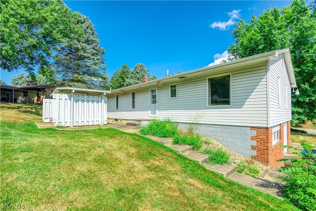 back of house with a yard