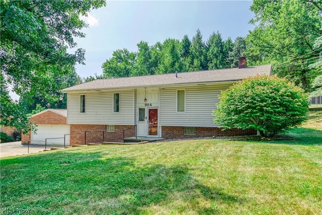 bi-level home with a front lawn