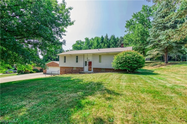 raised ranch with a front yard