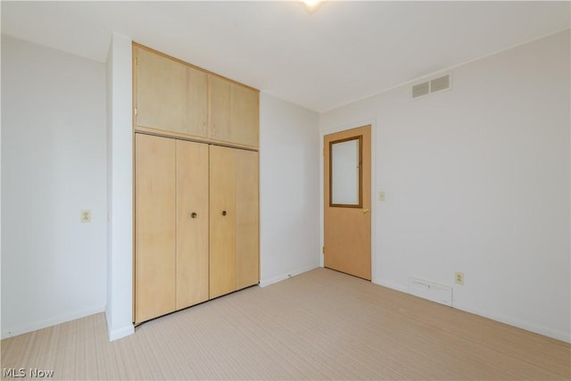 unfurnished bedroom featuring a closet