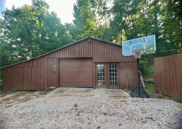 garage featuring wood walls