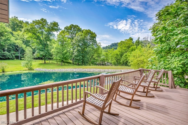 wooden terrace with a yard