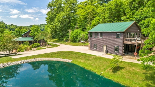 back of house with a lawn and a wooden deck