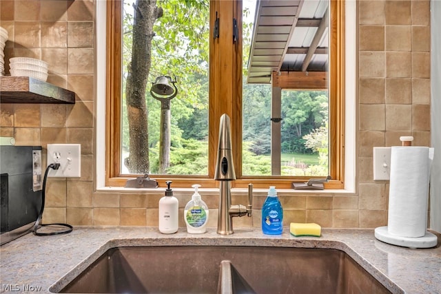 interior details with sink and tasteful backsplash