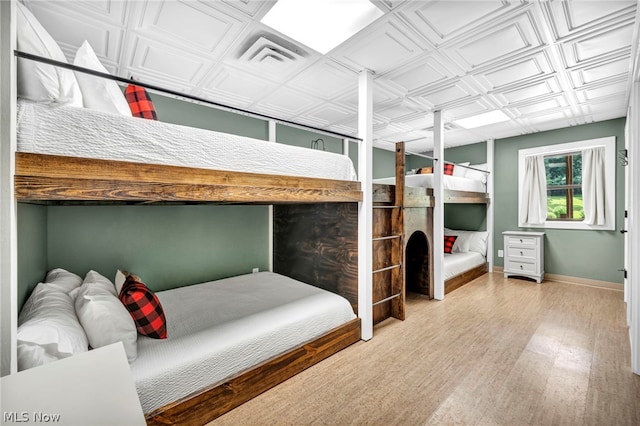 bedroom featuring hardwood / wood-style flooring