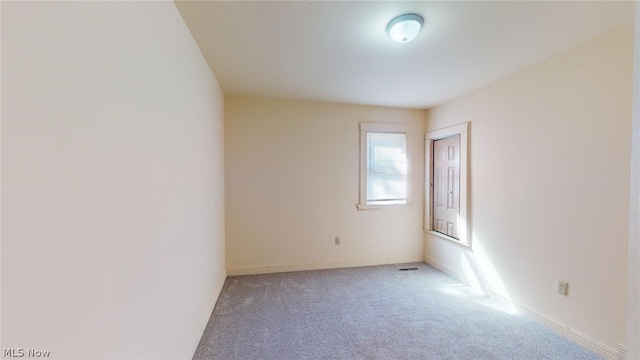 unfurnished room with carpet floors