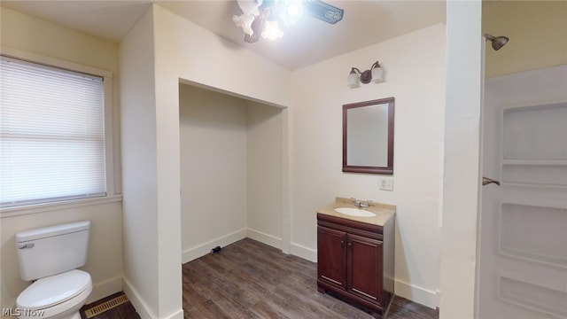 bathroom with vanity, hardwood / wood-style floors, and toilet