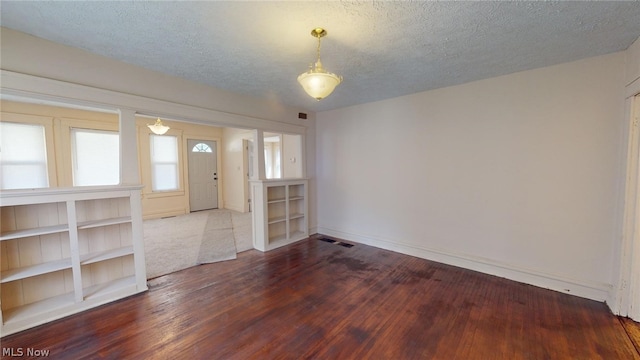 entrance foyer featuring hardwood / wood-style floors and a textured ceiling