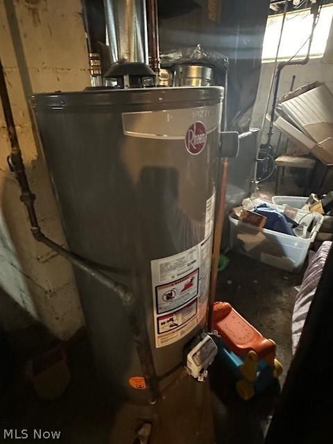 utility room featuring gas water heater