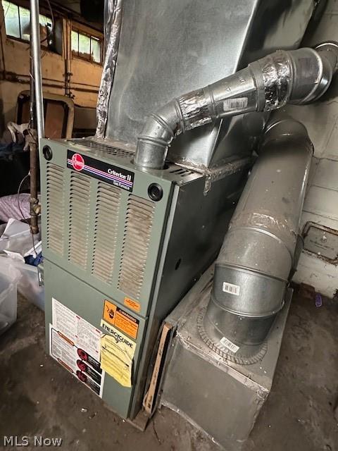 utility room with heating unit