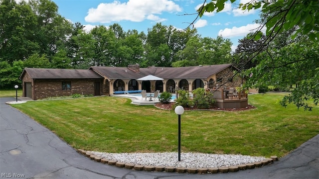 ranch-style home with a front lawn