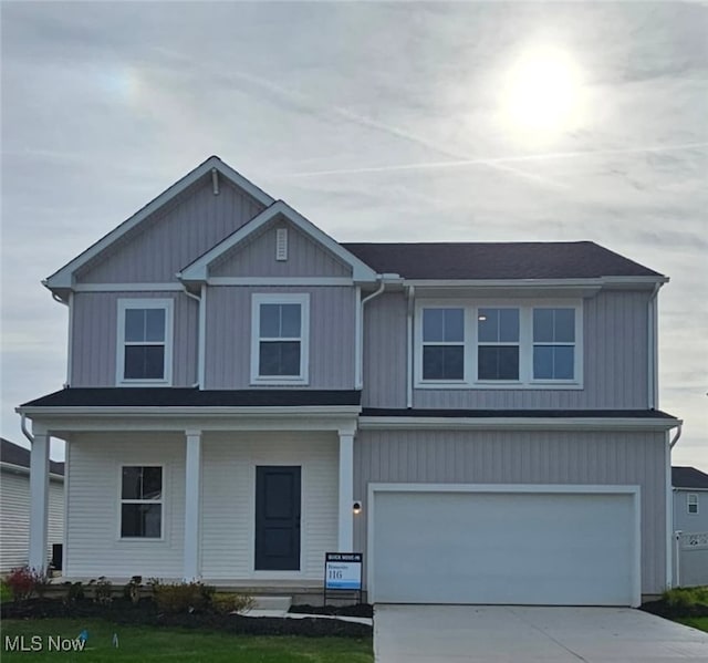 view of front of property with a garage and driveway