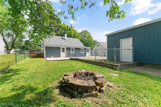 view of yard with an outdoor fire pit