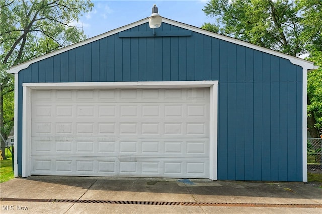 garage featuring wood walls