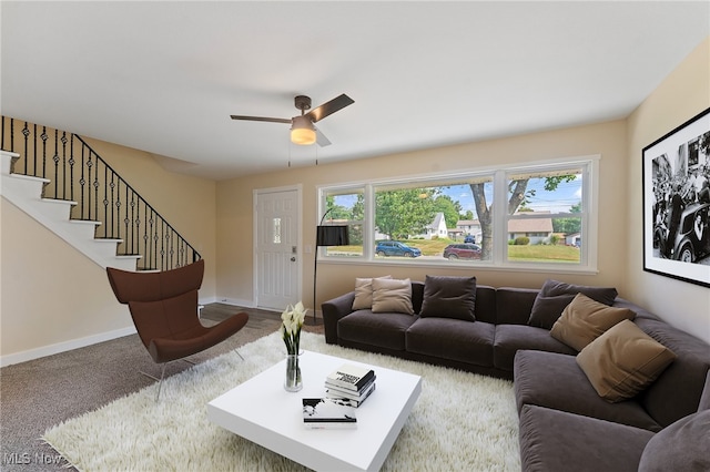 living room featuring ceiling fan and carpet flooring