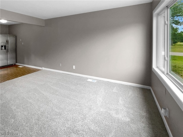 empty room featuring carpet flooring