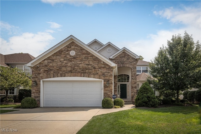 view of front property with a front yard and a garage