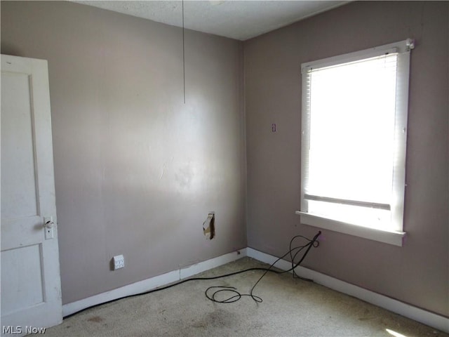 empty room with baseboards