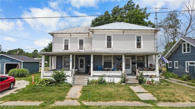 view of front of house with a porch and a front lawn