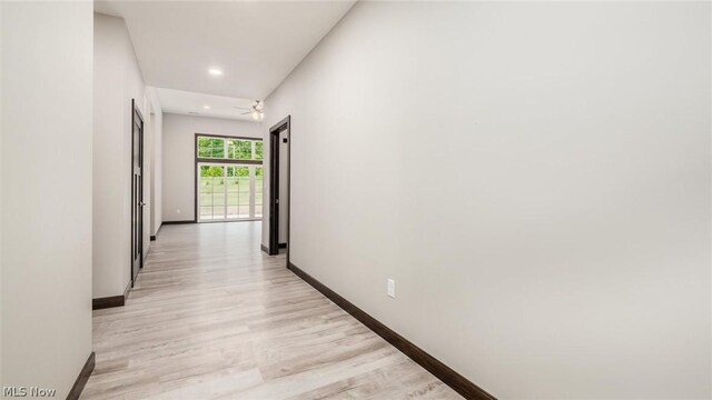 hall with light hardwood / wood-style flooring