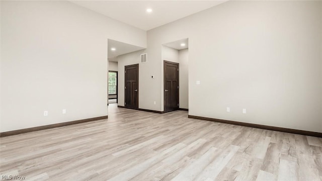 unfurnished room featuring light wood-type flooring