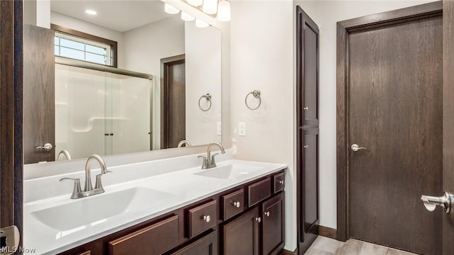 bathroom featuring vanity and walk in shower