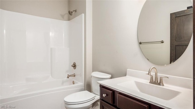 full bathroom with washtub / shower combination, vanity, and toilet