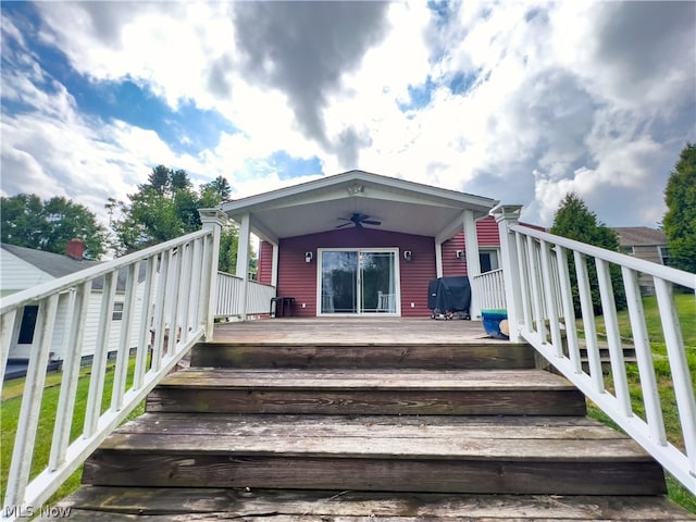 doorway to property featuring ceiling fan