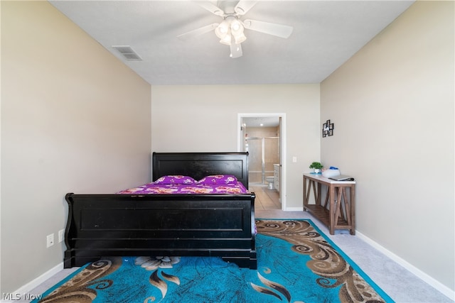 bedroom featuring ensuite bath, ceiling fan, and carpet flooring