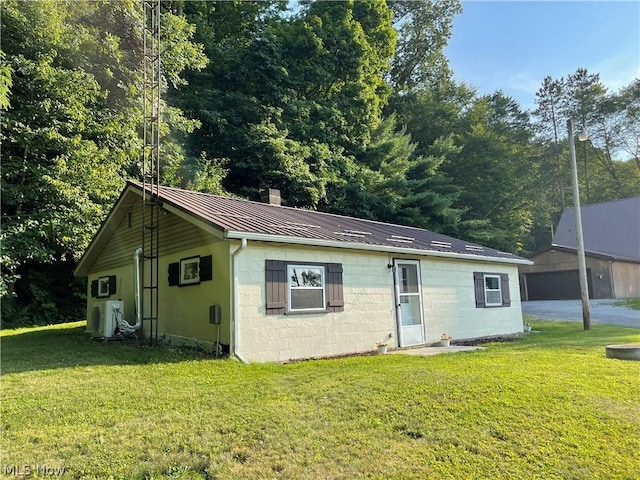 single story home featuring a front lawn and ac unit