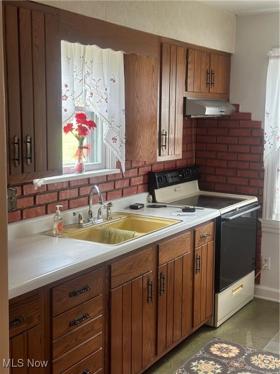 kitchen featuring plenty of natural light, sink, extractor fan, and electric range