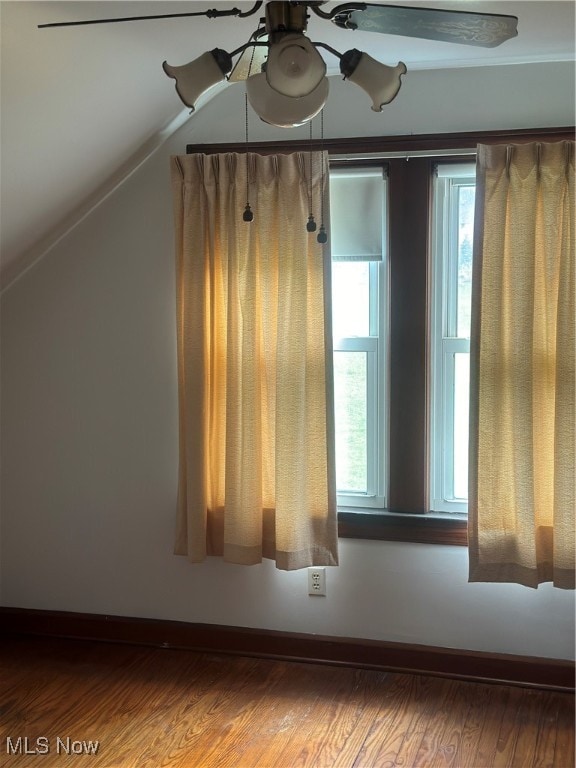 bonus room featuring hardwood / wood-style flooring, vaulted ceiling, and ceiling fan