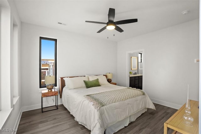 bedroom with visible vents, baseboards, a ceiling fan, and wood finished floors