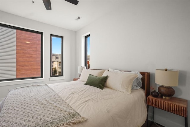 bedroom with ceiling fan and visible vents