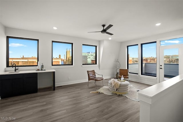 interior space with recessed lighting, light wood-style floors, baseboards, and ceiling fan
