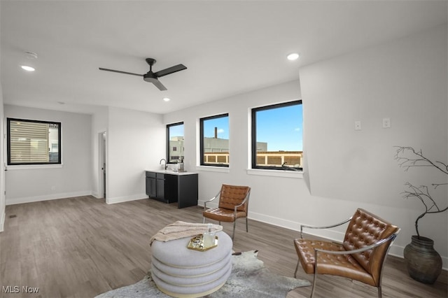 sitting room featuring recessed lighting, baseboards, a ceiling fan, and wood finished floors
