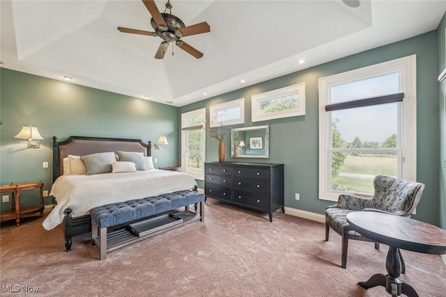 bedroom featuring baseboards, a raised ceiling, carpet, and vaulted ceiling