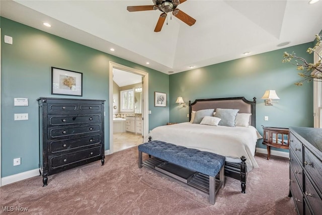 bedroom featuring lofted ceiling, ensuite bath, recessed lighting, carpet, and baseboards