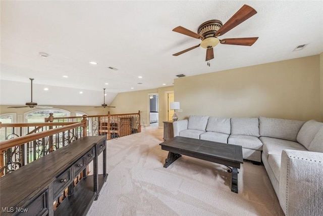 living room with vaulted ceiling, recessed lighting, light colored carpet, and visible vents