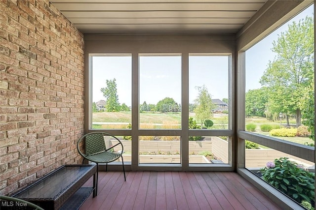 unfurnished sunroom with a wealth of natural light