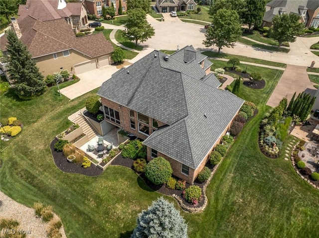 birds eye view of property with a residential view