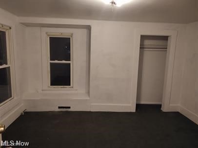 unfurnished bedroom with a closet